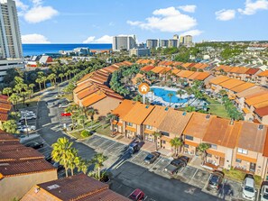 Aerial view showing the home's prime location, just a short walk to the neighborhood pool and beach