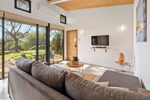 This airy living space is designed for comfort, with tranquil outlooks and a plush L-shaped lounge..