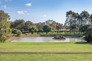 The peaceful estate lake offers a stunning backdrop for your stay.