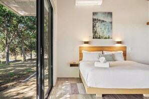 Wake up to lakeside views from the plush king-size bed, perfectly positioned for slow mornings and peaceful nights.