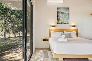 Wake up to lakeside views from the plush king-size bed, perfectly positioned for slow mornings and peaceful nights.