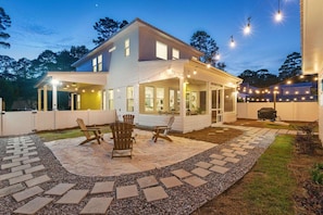 Backyard: Fenced, enclosed patio with eating area, grill, fire pit, corn hole