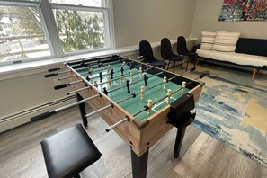 Show off your competitive spirit with a fun game of foosball in the lower-level lounge area