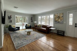 Unwind with your favorite shows or movies on the smart TV in this inviting living space