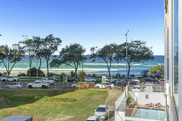 A stunning view of the beach and ocean stretches before you, capturing the essence of coastal tranquility.