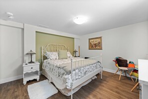 Rest easy in this charming bedroom featuring a cozy queen bed—your perfect retreat near Cobourg Beach!