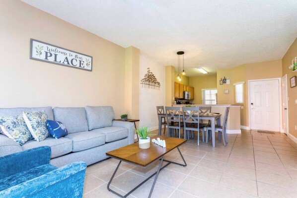 Open living space that seamlessly connects the beautiful kitchen and dining area, offering a perfect blend of comfort and style.