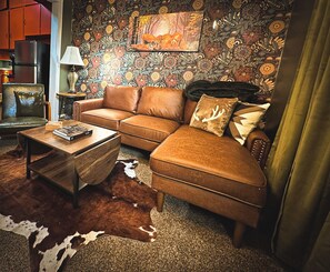 Living Room with Leather couch and easy chair.