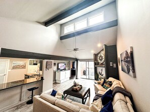 An inviting open-concept space combining the living room, dining area, and kitchen for seamless gatherings.