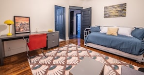 The second bedroom upstairs has a full size trundle bed and work space.