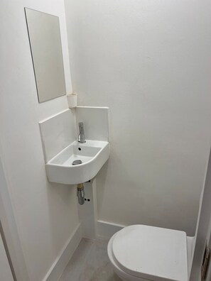 complete your serene stay with this minimalist bathroom
