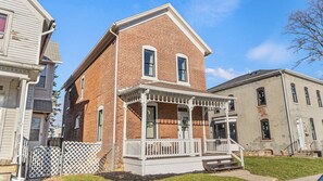 Charming brick two story home with front porch. 