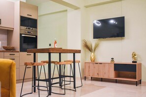 Dining area with a TV offering streaming services