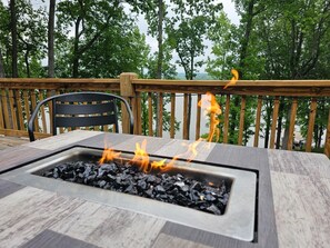 Fire Pit Patio: Gather around the fire for stargazing with stunning lake views in Cadiz!