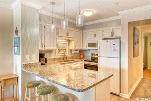 Full kitchen w dishwasher, stove, microwave, fridge w freezer ice maker.  