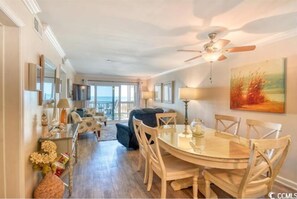 Open floor plan...dining & living room with balcony access