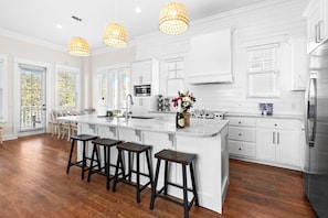 Full kitchen is beautiful and functional
