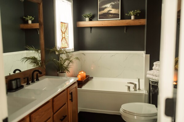 Elegant Primary Bedroom-Attached Bath with spacious soaking tub.