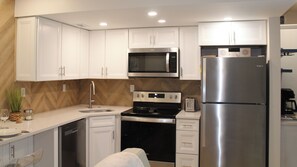 Fully equipped kitchen and an in-unit washer/dryer.