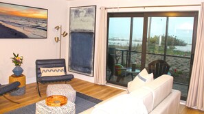 Smart TV. Luxurious leather chairs, leather sofa sleeper. Ottoman table.