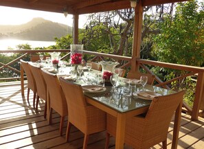 Outdoor dinning table on our gorgeous ocean view deck