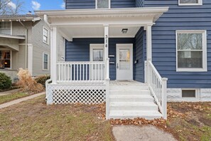 Welcoming front porch with rocking chairs, ideal for enjoying the outdoors
