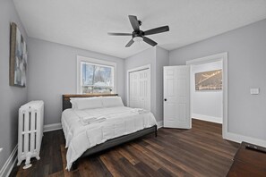 Modern and relaxing king bedroom with comfortable furnishings and a neutral color palette