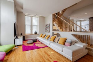 Living Room: Relax with plush seating and stream your favorites