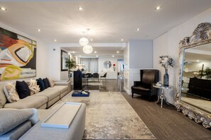 Living Room: Open layout with luxe finishes and warm vibes.