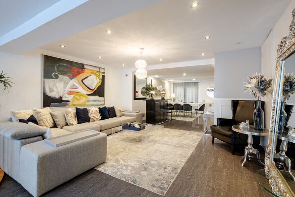 Living Room : Another angle of the sophisticated living area showcasing elegant decor, ample seating, and a perfect blend of comfort and style.