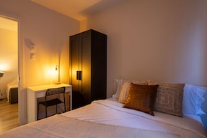 Bedroom 1 – Alternate angle with desk and wardrobe