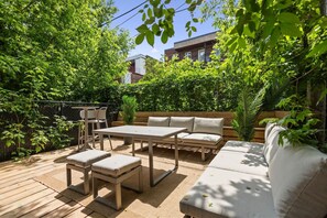 Tranquil outdoor patio surrounded by lush greenery