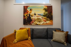 Bold artwork and plush cushions make this the perfect spot to unwind.