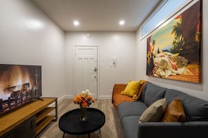 Warm up by the sleek electric fireplace in this inviting lounge.
