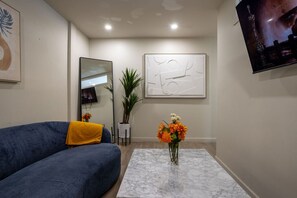 Entertainment-ready with a big screen and cozy ambiance.