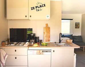 The contemporary kitchen blends functionality with charm, making meal preparation a joyful experience for the entire family.