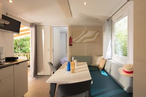 Relax in the comfortable living area with modern interiors and ample space.