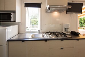 Cook your favorite meals in the fully equipped kitchenette with modern appliances.