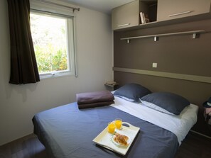 Rest comfortably in this well-appointed double bedroom with thoughtful touches.