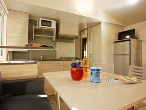 Prepare meals and enjoy dining in the fully equipped kitchenette with a cozy dining space.