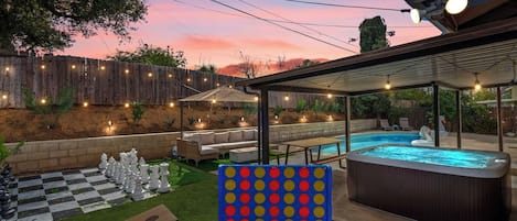 Backyard with Chess Board, Connect 4 and Cornhole Games