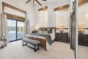 Upstairs bedroom w/ king bed, fireplace, walk out balcony and ensuite bathroom.