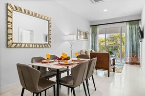 Open-concept living area with a dining table and a view.