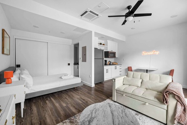 Relax in this cozy open-layout studio featuring a plush queen bed, stylish decor, and a welcoming ambiance—perfect for a comfortable stay!