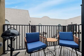 Step outside to your private balcony & enjoy the ocean breeze & BBQ grill.