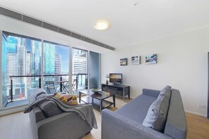 A spacious living with a 3-seater sofa bed that folds out to a double.