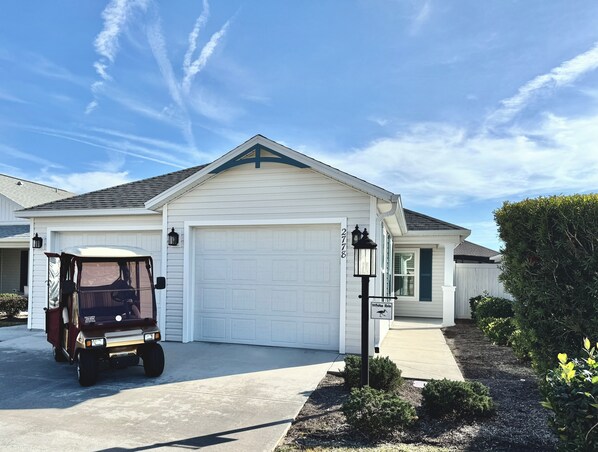 House Front with Golf Cart for Guest Use!