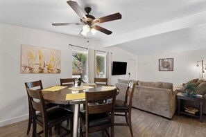  The inviting table and stylish seating create the perfect backdrop for shared laughter and delicious food.