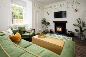 Grooms Cottage - bringing Kailzie Gardens inside with flowers and a beautiful leaf mural