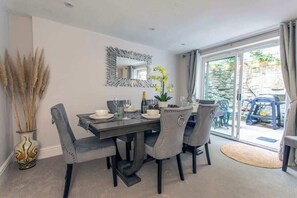 Dining room with seating for 6/7 guests and outside terrace with BBQ